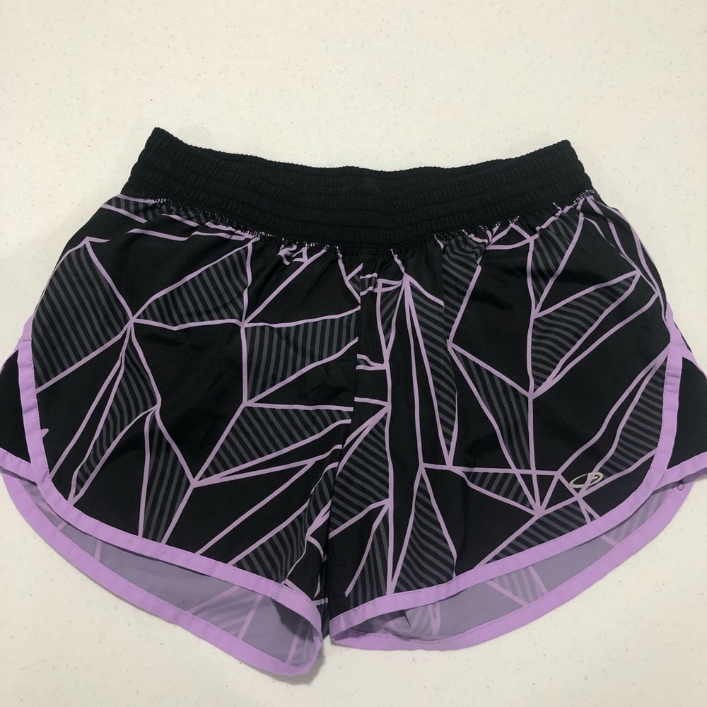 black and purple champion running shorts